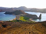 
The panoramic view from the summit of Bartolome is probably the most photographed landscape in the islands. You can see the twin bays, the Pinnacle Rock, the moonlike landscape and a view of Santiago Island close by and its famous Sullivan bay.

